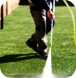 A man working on an artificial turf cleaning project in Glendale.